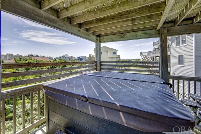 deck featuring a hot tub