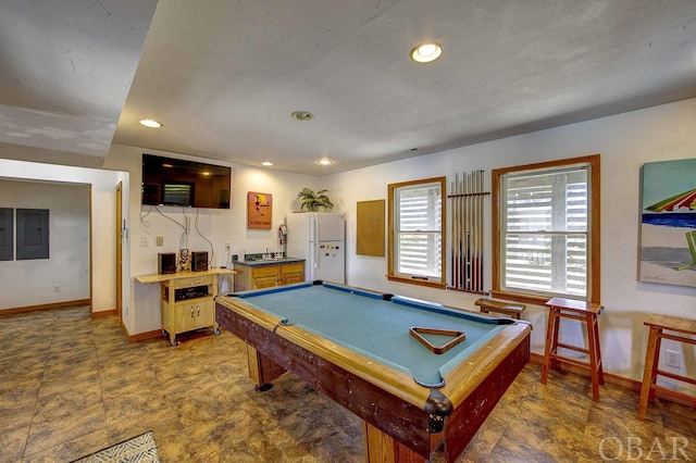 playroom featuring electric panel, baseboards, and recessed lighting