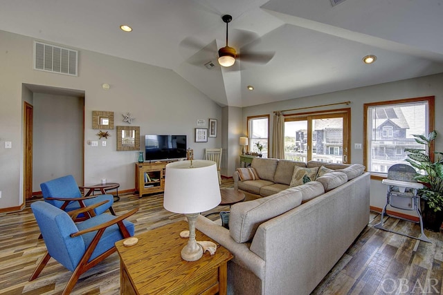 living room featuring recessed lighting, visible vents, vaulted ceiling, and wood finished floors