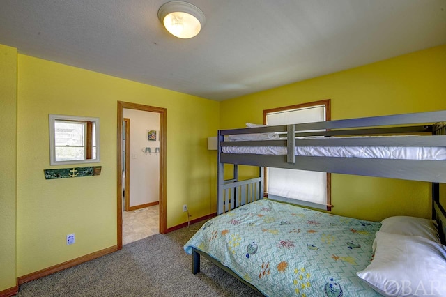 carpeted bedroom with baseboards