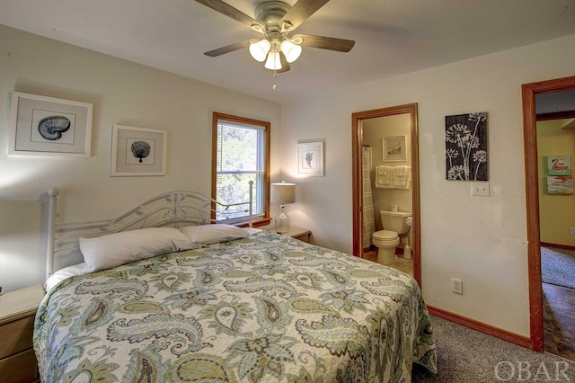 carpeted bedroom with connected bathroom, a ceiling fan, and baseboards