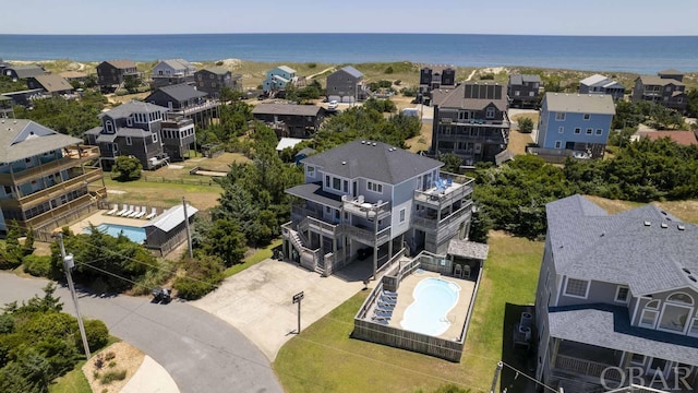 bird's eye view featuring a water view and a residential view