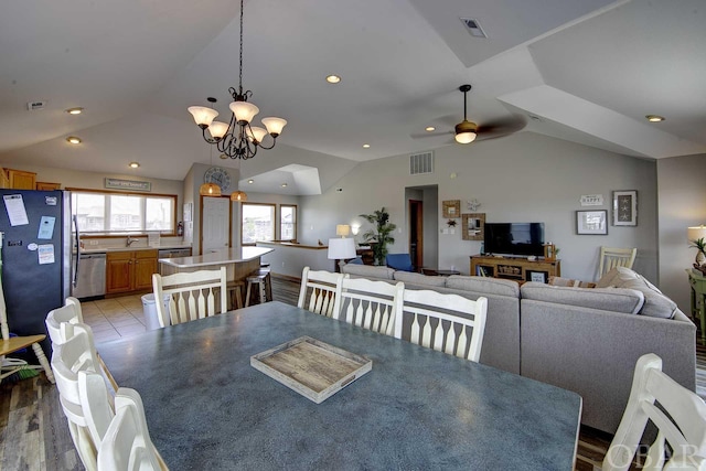 dining space featuring recessed lighting, visible vents, and vaulted ceiling