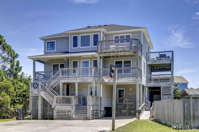 view of front of home with covered porch and stairway