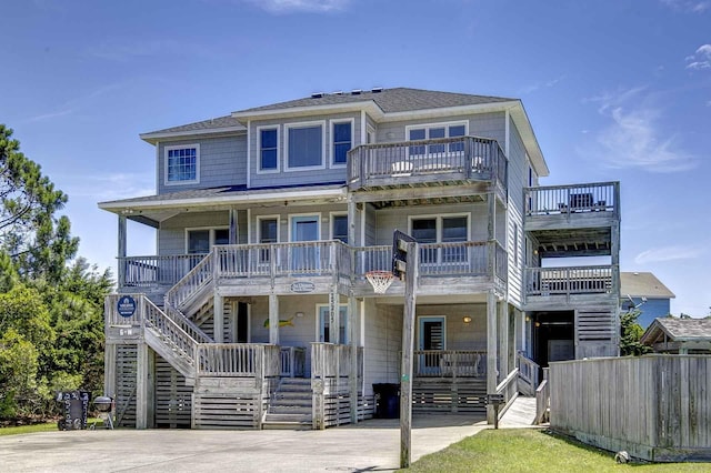 view of front of home with covered porch and stairway