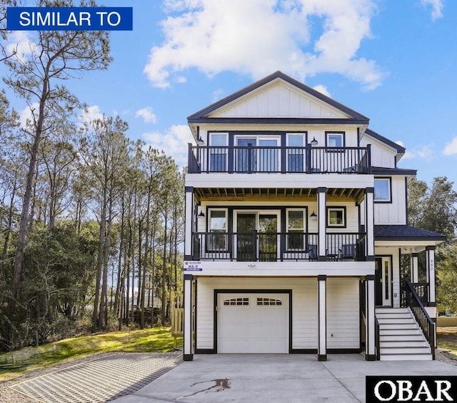 887 Marsh Lndg Lot # 249, Corolla, NC 27927 - raised beach house with a balcony, an attached garage, board and batten siding, and concrete driveway