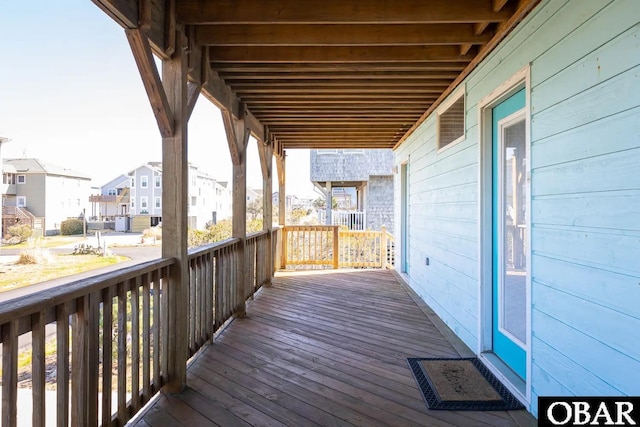 wooden terrace with a residential view