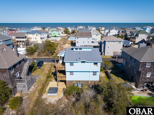 birds eye view of property featuring a residential view and a water view