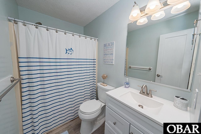 756 Mariner Dr Lot 2, Corolla, NC 27927 - bathroom featuring toilet, a textured ceiling, wood finished floors, vanity, and a shower with shower curtain