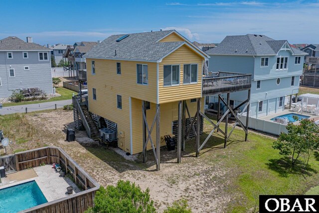 756 Mariner Dr Lot 2, Corolla, NC 27927 - back of house with stairway, a deck, a residential view, and a fenced backyard