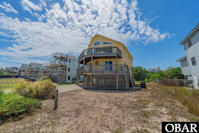 756 Mariner Dr Lot 2, Corolla, NC 27927 - rear view of house with stairway, a deck, and fence