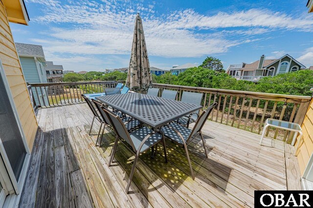 756 Mariner Dr Lot 2, Corolla, NC 27927 - wooden terrace with outdoor dining area and a residential view