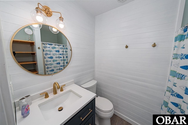 756 Mariner Dr Lot 2, Corolla, NC 27927 - bathroom with toilet, wood finished floors, vanity, a shower with curtain, and a textured ceiling