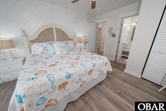 756 Mariner Dr Lot 2, Corolla, NC 27927 - bedroom with wood finished floors, baseboards, a ceiling fan, and ensuite bathroom