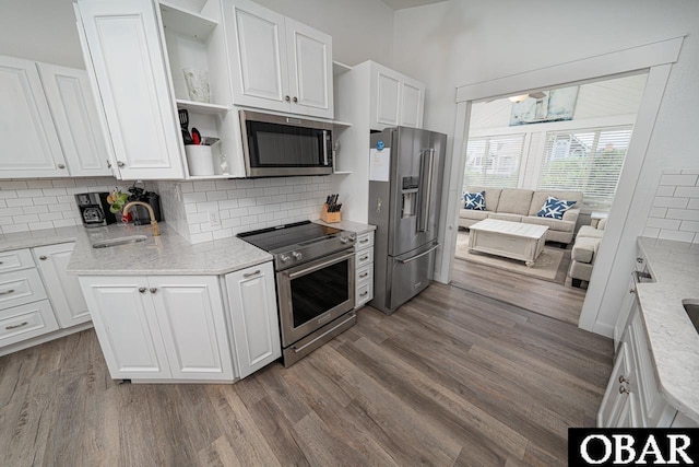 756 Mariner Dr Lot 2, Corolla, NC 27927 - kitchen featuring stainless steel appliances, open shelves, a sink, dark wood-type flooring, and white cabinetry