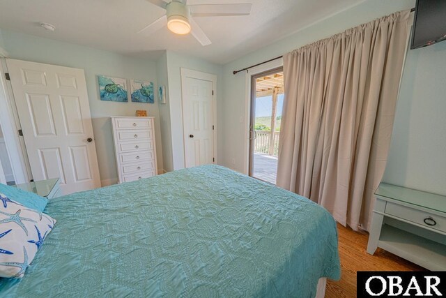 25259 Sea Isle Hills Dr Lot 7, Waves, NC 27982 - bedroom with light wood-type flooring, ceiling fan, and access to outside