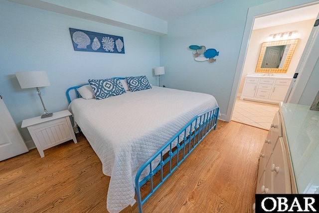 25259 Sea Isle Hills Dr Lot 7, Waves, NC 27982 - bedroom featuring light wood-type flooring and ensuite bath