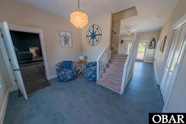 25259 Sea Isle Hills Dr Lot 7, Waves, NC 27982 - stairway with a chandelier, baseboards, ceiling fan, and wood finished floors