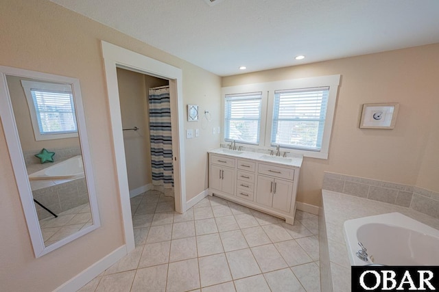 25259 Sea Isle Hills Dr Lot 7, Waves, NC 27982 - full bathroom featuring plenty of natural light, a bath, tile patterned flooring, double vanity, and recessed lighting