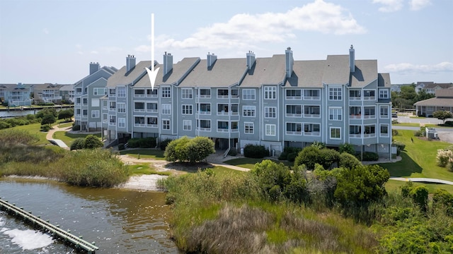 view of building exterior with a water view