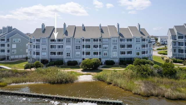 view of building exterior featuring a water view