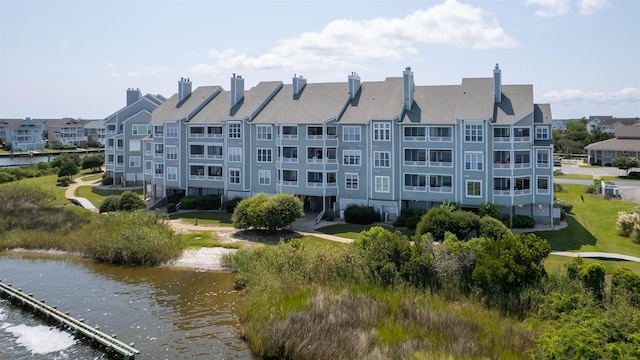 view of building exterior with a water view