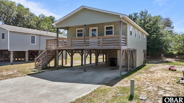 2018 Yorktown St Lot # 1365, Kill Devil Hills, NC 27948 - beach home with a carport, covered porch, driveway, and stairs