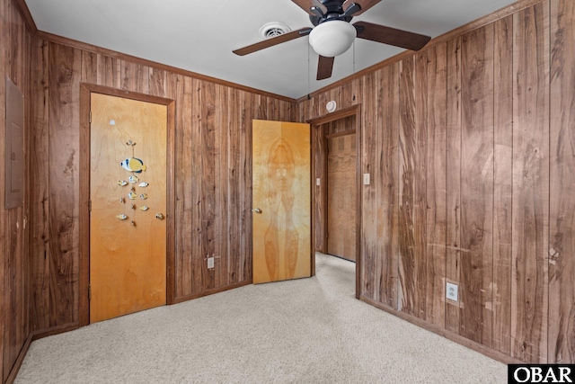 2018 Yorktown St Lot # 1365, Kill Devil Hills, NC 27948 - unfurnished bedroom featuring wooden walls, carpet flooring, and ceiling fan