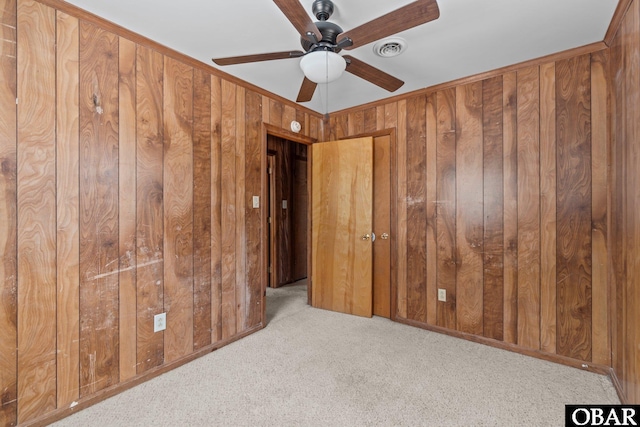 2018 Yorktown St Lot # 1365, Kill Devil Hills, NC 27948 - unfurnished bedroom with wooden walls, carpet floors, and a ceiling fan