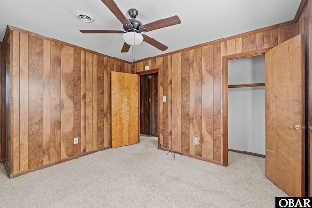 2018 Yorktown St Lot # 1365, Kill Devil Hills, NC 27948 - unfurnished bedroom featuring light colored carpet, wood walls, a closet, and ceiling fan