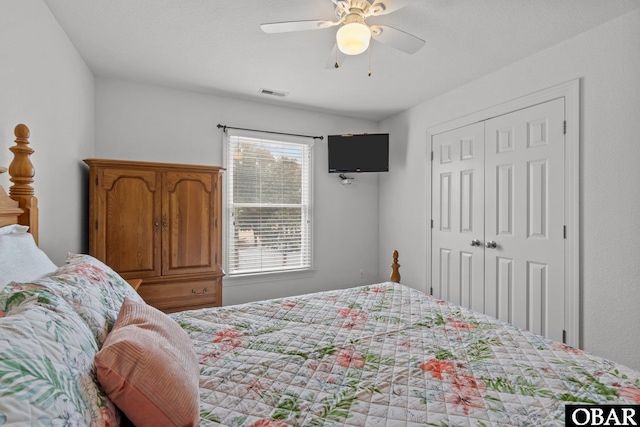 bedroom featuring visible vents, a closet, and ceiling fan