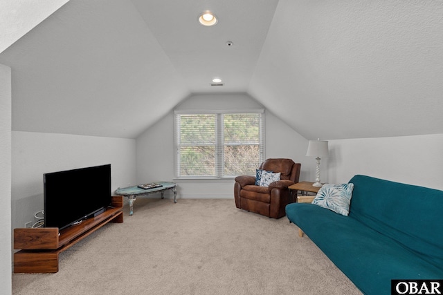 carpeted living area featuring recessed lighting, baseboards, and lofted ceiling