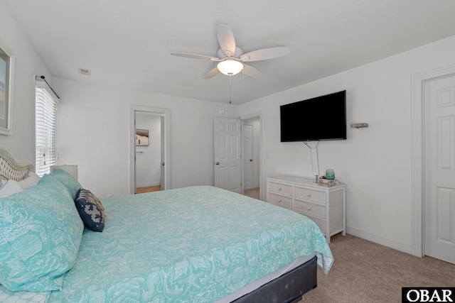 carpeted bedroom with baseboards and a ceiling fan