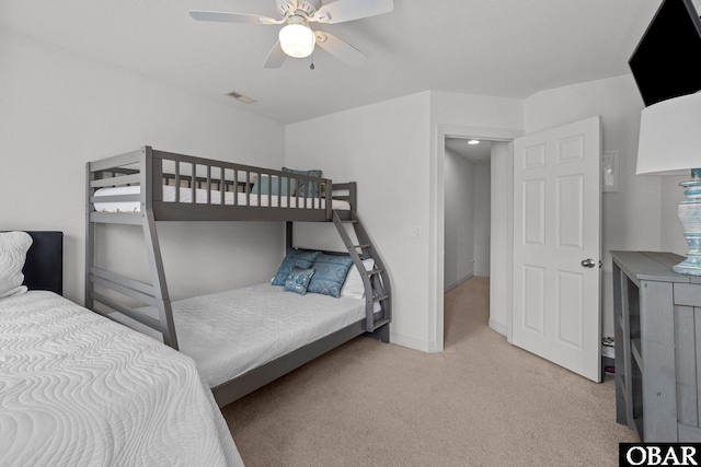 bedroom featuring visible vents, baseboards, ceiling fan, and carpet floors