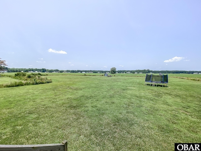 284 Old Swamp Rd, South Mills, NC 27976 - view of grassy yard featuring a trampoline and a view of rural / pastoral area