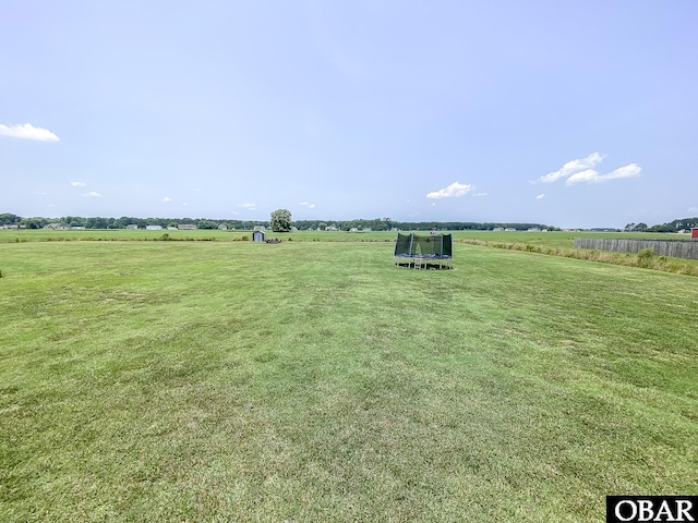 284 Old Swamp Rd, South Mills, NC 27976 - view of grassy yard featuring a trampoline and a rural view