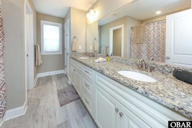 284 Old Swamp Rd, South Mills, NC 27976 - bathroom with wood finished floors and double vanity