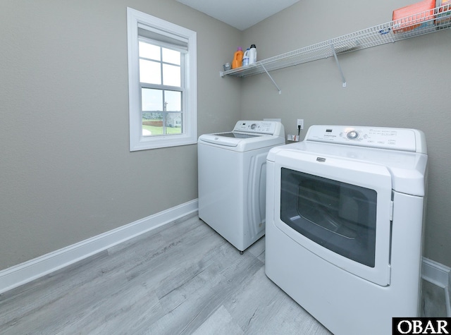 284 Old Swamp Rd, South Mills, NC 27976 - laundry area with washing machine and clothes dryer and light wood-style floors