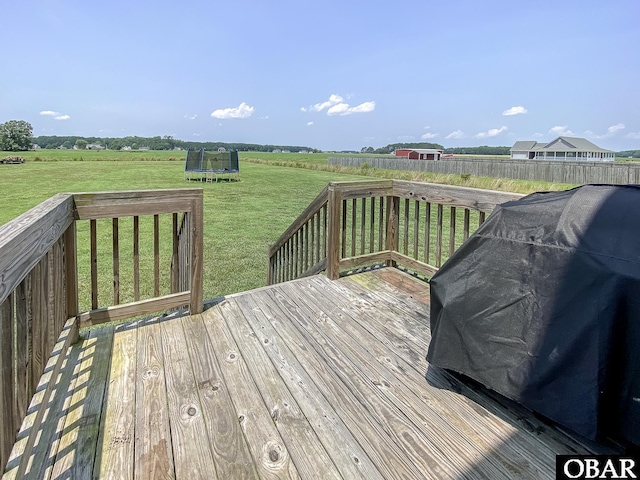 284 Old Swamp Rd, South Mills, NC 27976 - wooden deck with a trampoline, a lawn, and a grill