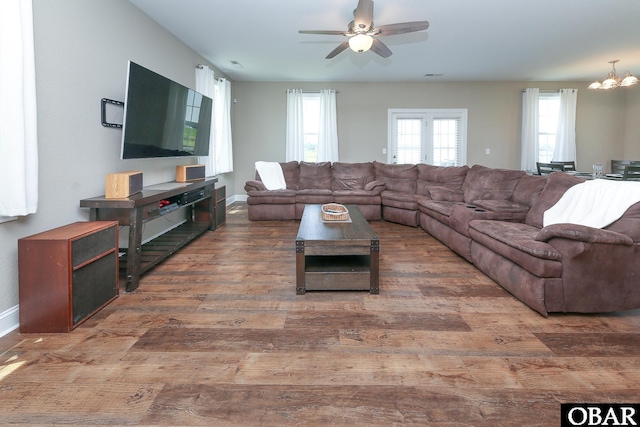 284 Old Swamp Rd, South Mills, NC 27976 - living area featuring wood finished floors, ceiling fan, and a chandelier