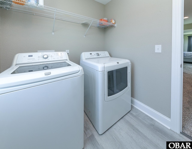 284 Old Swamp Rd, South Mills, NC 27976 - laundry room featuring independent washer and dryer and light wood finished floors