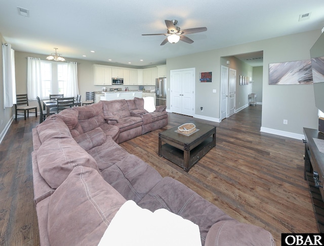 284 Old Swamp Rd, South Mills, NC 27976 - living room featuring dark wood finished floors, a ceiling fan, recessed lighting, and a chandelier