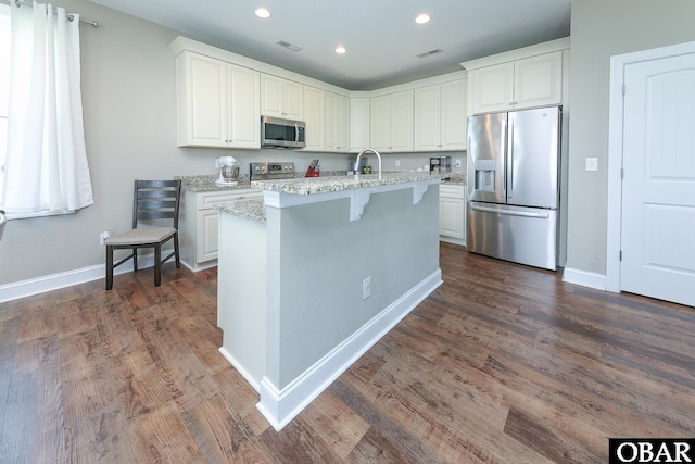 284 Old Swamp Rd, South Mills, NC 27976 - kitchen with stainless steel appliances, white cabinetry, a kitchen island with sink, dark wood finished floors, and recessed lighting
