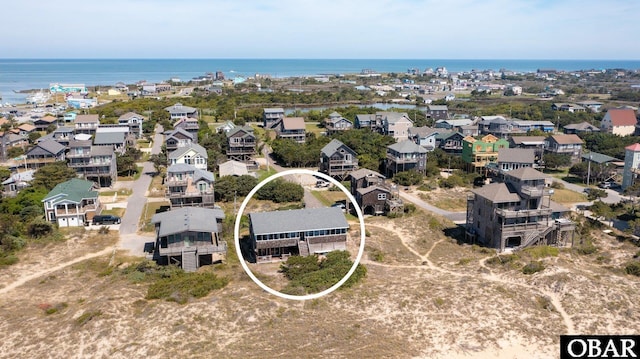 bird's eye view with a water view and a residential view