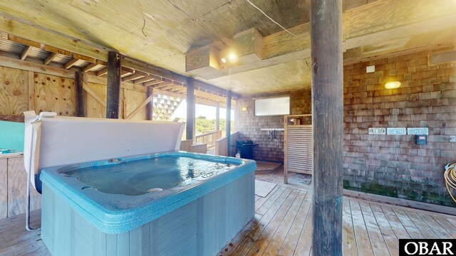 miscellaneous room featuring wood-type flooring, a jacuzzi, and wooden ceiling