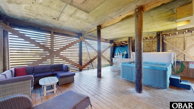 exterior space featuring outdoor lounge area and a hot tub