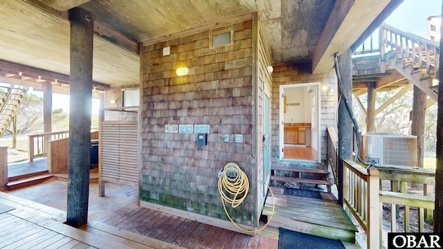 doorway to property featuring central air condition unit
