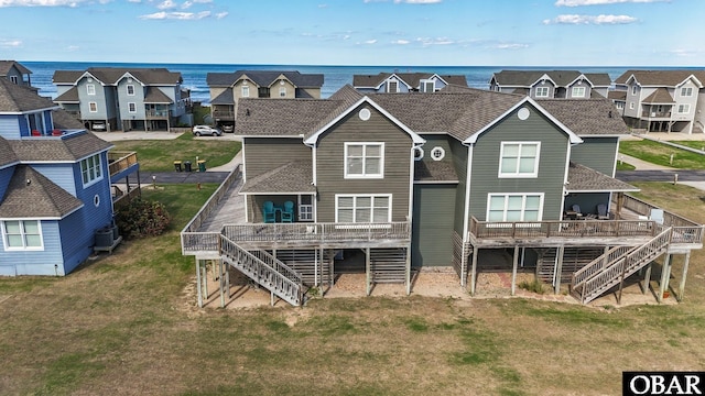 11 Pelican Watch Way Unit A/Lot11, Southern Shores, NC 27949 - back of property with stairway, a deck with water view, and a residential view