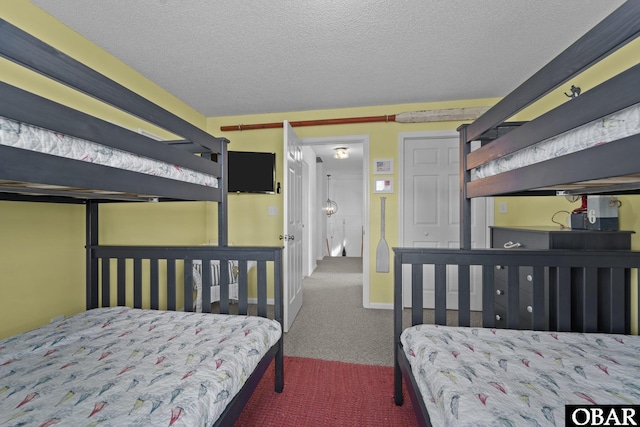 11 Pelican Watch Way Unit A/Lot11, Southern Shores, NC 27949 - bedroom featuring carpet floors and a textured ceiling