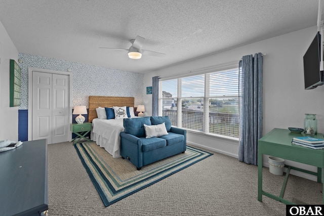 11 Pelican Watch Way Unit A/Lot11, Southern Shores, NC 27949 - bedroom with a textured ceiling, carpet flooring, a ceiling fan, and a closet